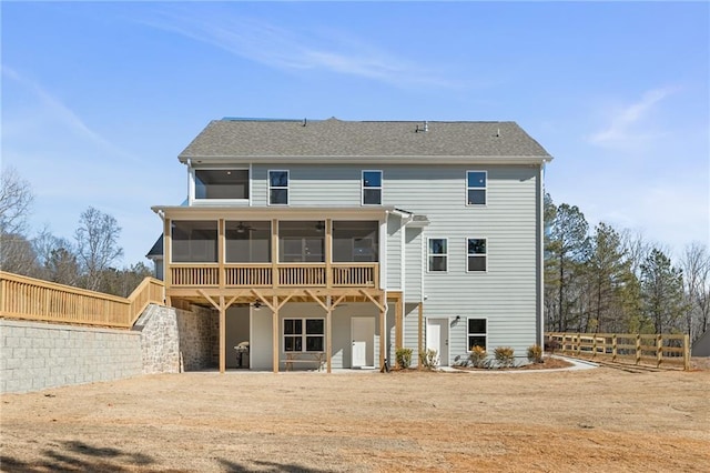 back of house with a sunroom