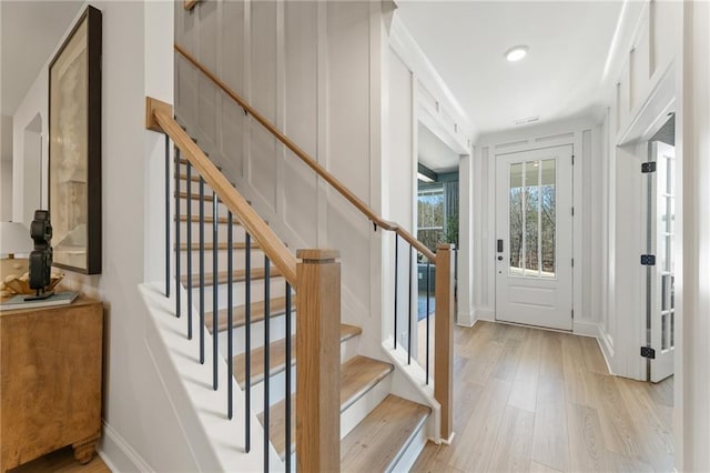 entryway with light hardwood / wood-style flooring