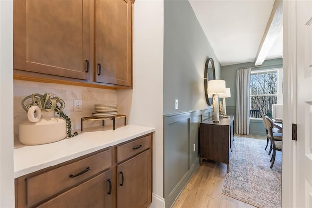 kitchen featuring backsplash and light wood-type flooring