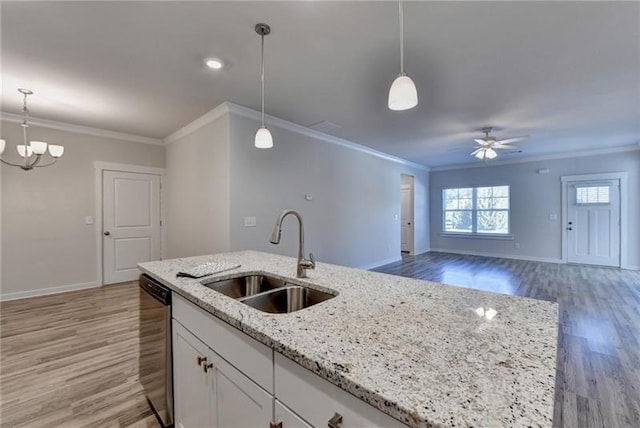 kitchen with white cabinetry, a sink, light wood finished floors, and dishwasher