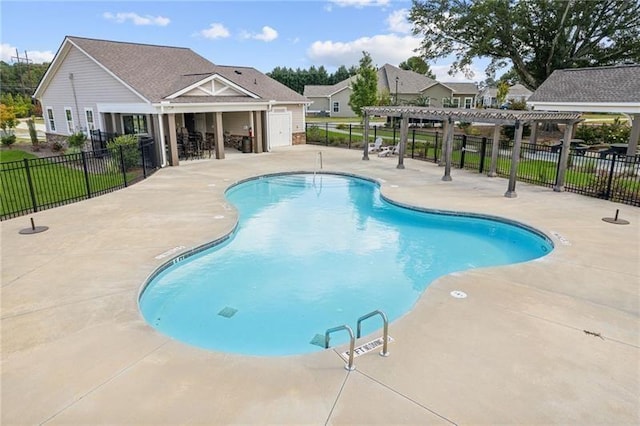 pool featuring a patio, fence, and a pergola