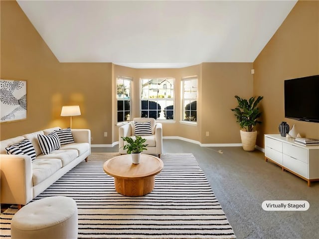 living area with carpet flooring, baseboards, and vaulted ceiling