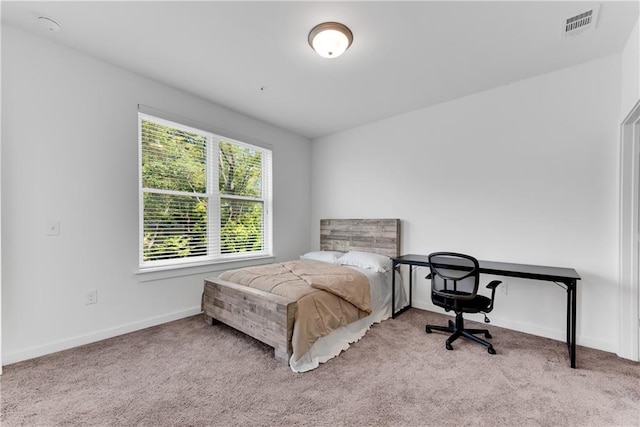 bedroom with light carpet