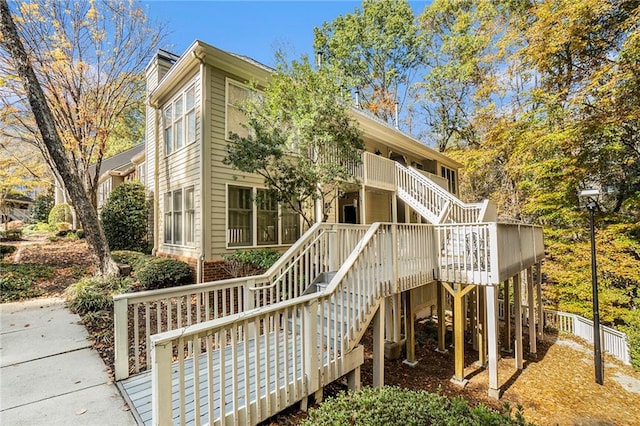 rear view of house with a wooden deck