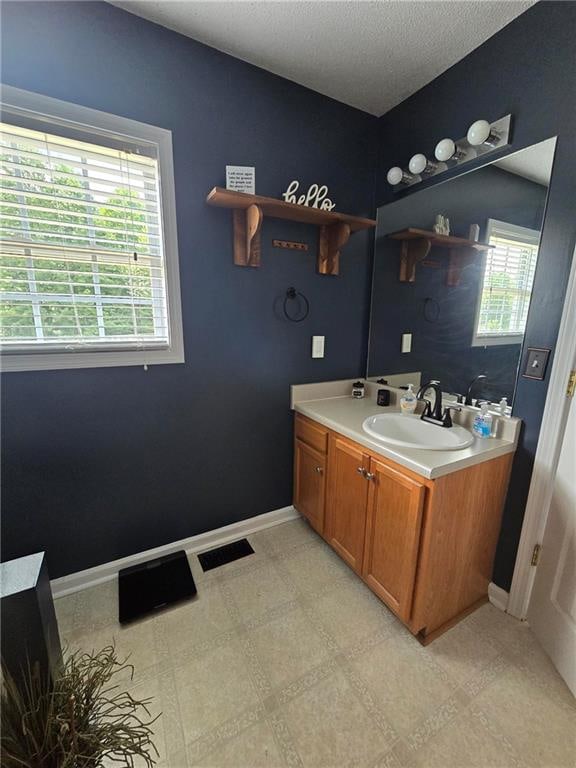 bathroom with vanity and tile patterned flooring