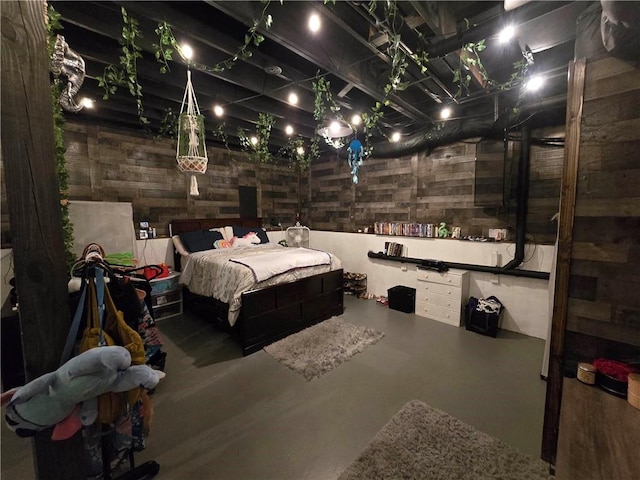 bedroom featuring concrete flooring