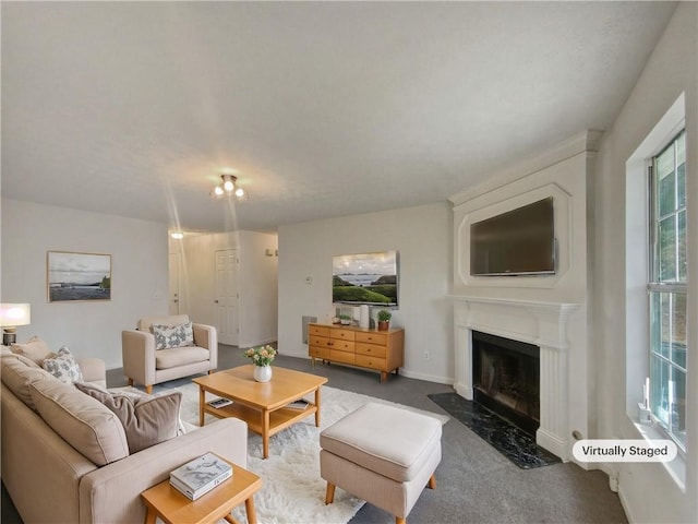 living room featuring a premium fireplace and carpet floors