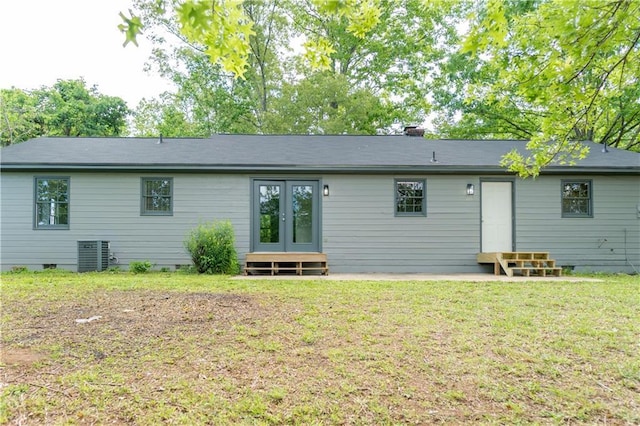 rear view of house featuring french doors, entry steps, central AC unit, and crawl space