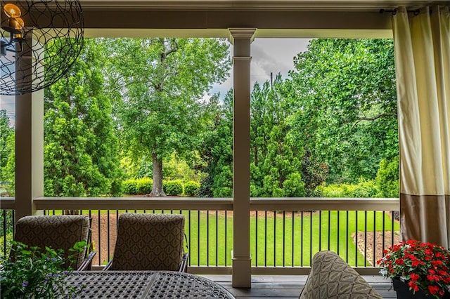 wooden deck featuring a yard