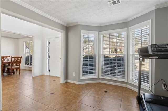 workout area with plenty of natural light, visible vents, and ornamental molding