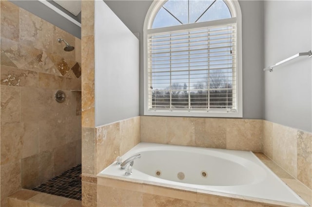 bathroom with a jetted tub and a walk in shower