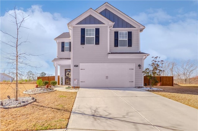 view of front of house featuring a garage and a front lawn