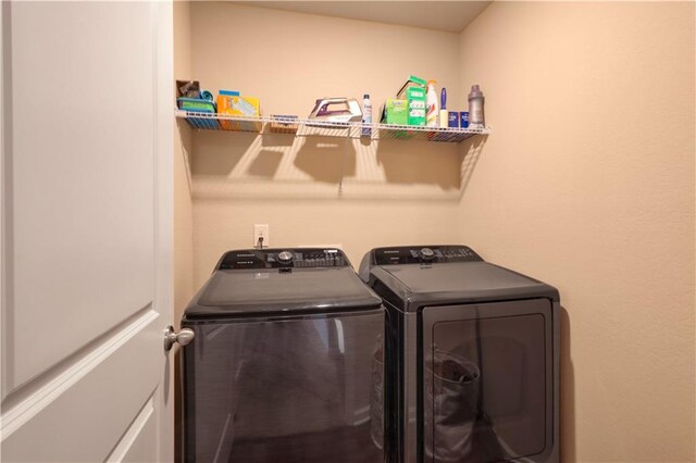 laundry room featuring washer and clothes dryer