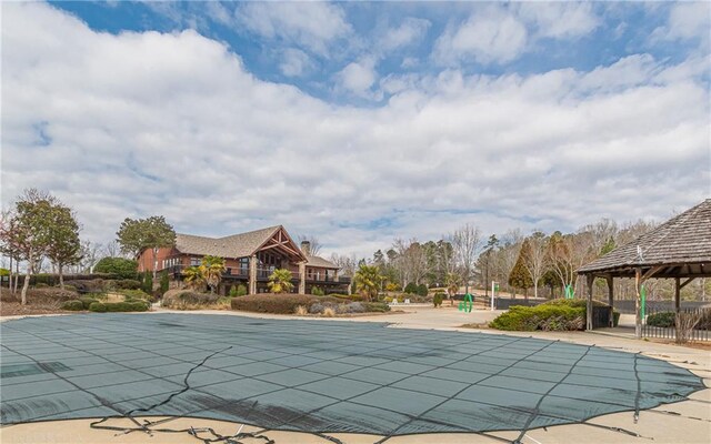 view of swimming pool with a gazebo and a patio area