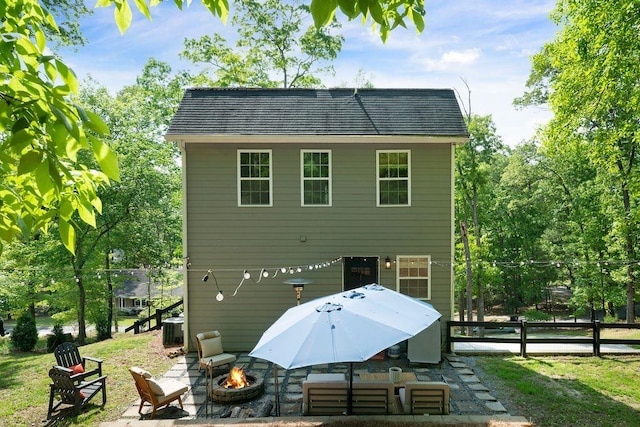 15 Swallow Dr SE, White, GA 30184 - back of property with an outdoor fire pit, central AC, and a patio