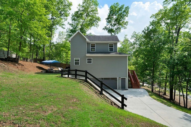 15 Swallow Dr SE, White, GA 30184 - view of front of house with stairway, a garage, a front lawn, and concrete driveway