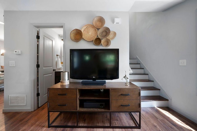 15 Swallow Dr SE, White, GA 30184 - living room featuring dark wood-style flooring, stairs, and baseboards