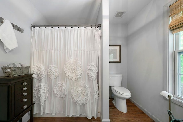 15 Swallow Dr SE, White, GA 30184 - bathroom with wood finished floors, toilet, baseboards, and curtained shower