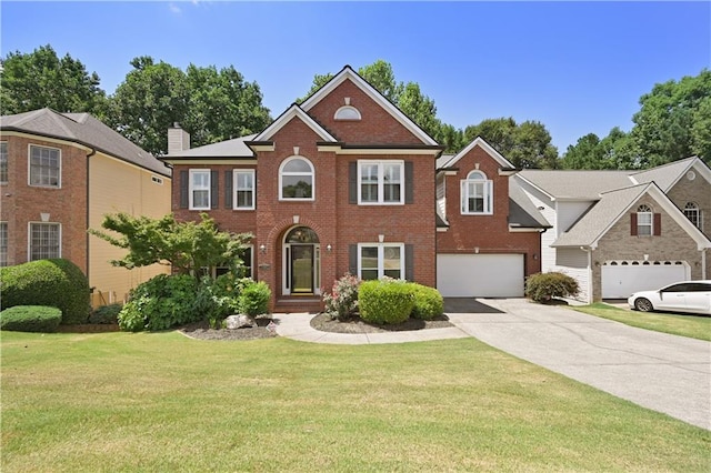 view of front of home featuring a garage and a front lawn