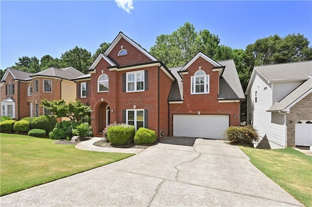 view of front of home with a front yard, an attached garage, brick siding, and driveway