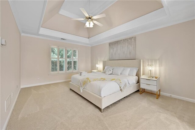 bedroom with carpet, ceiling fan, a raised ceiling, and crown molding