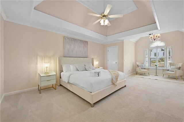 carpeted bedroom featuring ceiling fan with notable chandelier and a raised ceiling