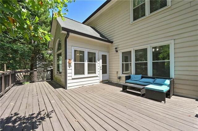 wooden terrace with outdoor lounge area