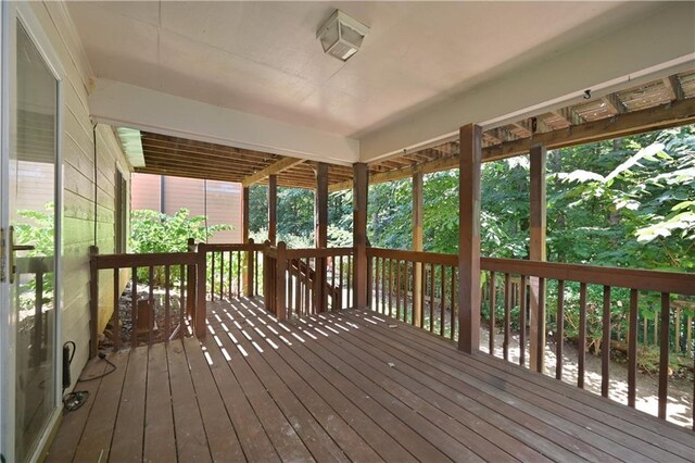 unfurnished sunroom with a wealth of natural light