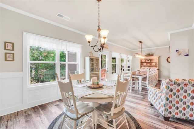 210 Riverpoint Way, Jackson, GA 30233 - dining space with wood finished floors, crown molding, and a chandelier