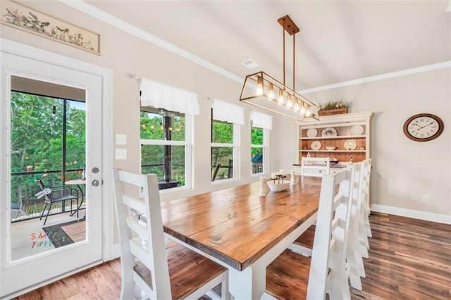 210 Riverpoint Way, Jackson, GA 30233 - dining area featuring crown molding, healthy amount of natural light, wood finished floors, and baseboards