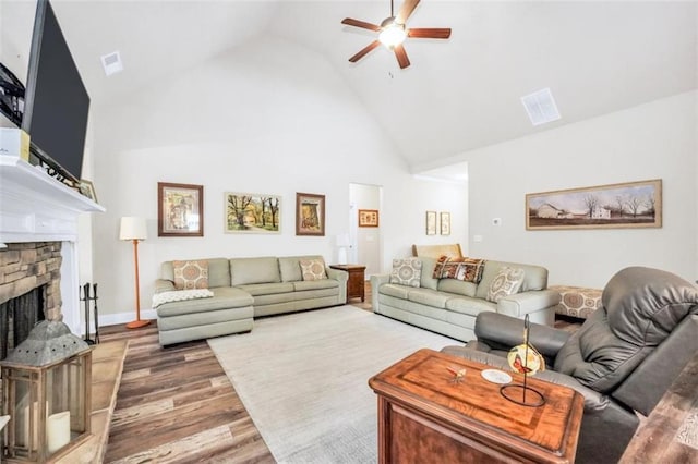 210 Riverpoint Way, Jackson, GA 30233 - living area with ceiling fan, high vaulted ceiling, wood finished floors, and a fireplace