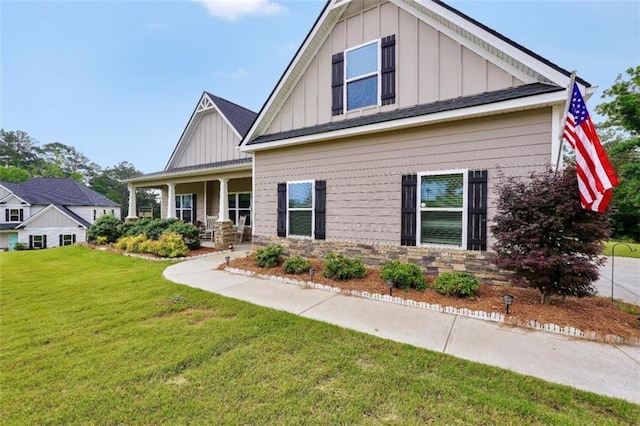 210 Riverpoint Way, Jackson, GA 30233 - craftsman inspired home featuring board and batten siding, a front lawn, and a porch