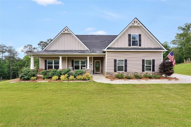 210 Riverpoint Way, Jackson, GA 30233 - craftsman inspired home featuring board and batten siding, a front yard, and covered porch