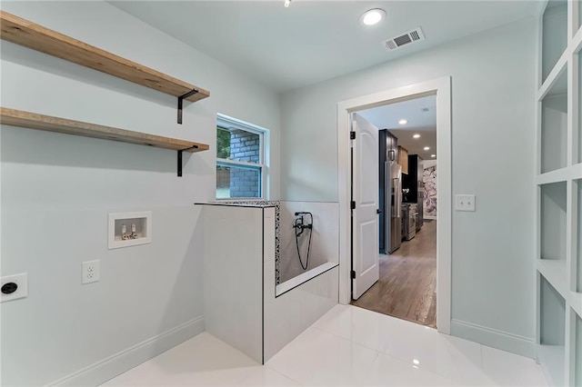 clothes washing area with hookup for a washing machine, tile patterned flooring, and hookup for an electric dryer