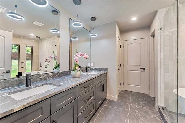 bathroom featuring vanity and an enclosed shower