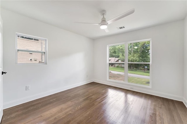 unfurnished room featuring dark hardwood / wood-style flooring and ceiling fan