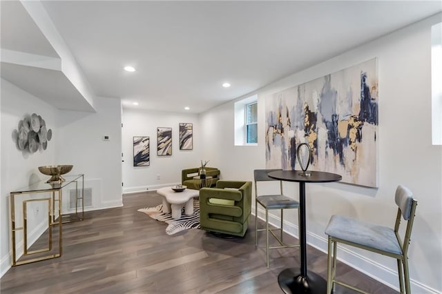 sitting room featuring dark hardwood / wood-style floors