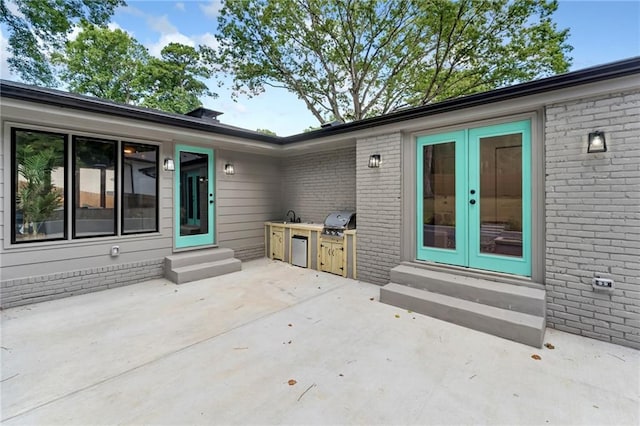 view of patio / terrace featuring grilling area and exterior kitchen