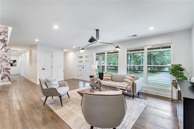 living room with dark hardwood / wood-style flooring