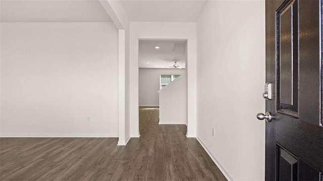 corridor featuring dark hardwood / wood-style flooring