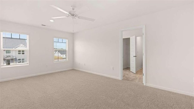 carpeted empty room with ceiling fan