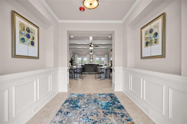 hallway featuring crown molding, beamed ceiling, and light tile patterned floors