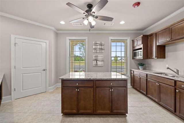 kitchen featuring sink and dark brown cabinets