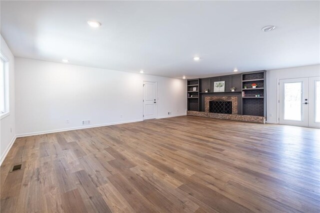 96 Sam Alexander Rd, Douglasville, GA 30134 - unfurnished living room featuring baseboards, wood finished floors, and recessed lighting