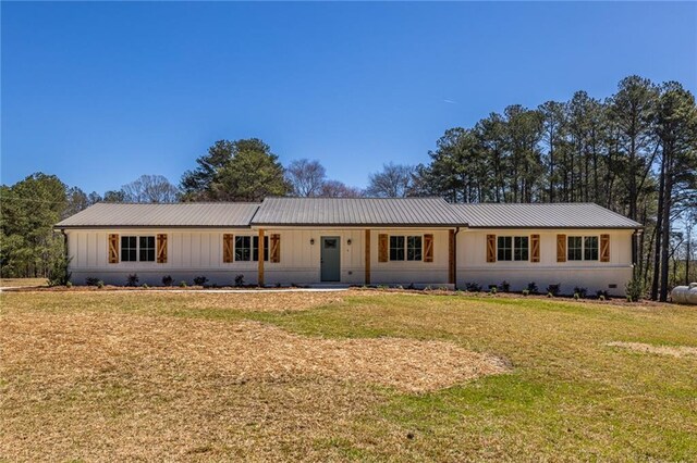 96 Sam Alexander Rd, Douglasville, GA 30134 - ranch-style home with metal roof, a front lawn, and board and batten siding