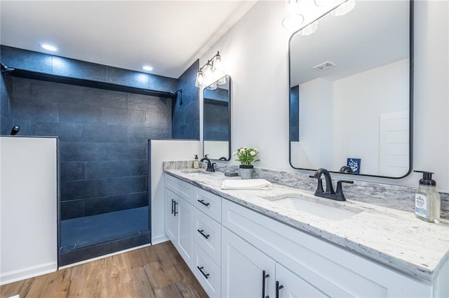 96 Sam Alexander Rd, Douglasville, GA 30134 - full bath featuring walk in shower, a sink, visible vents, and wood finished floors