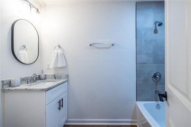 96 Sam Alexander Rd, Douglasville, GA 30134 - bathroom with baseboards, shower / bathing tub combination, and vanity