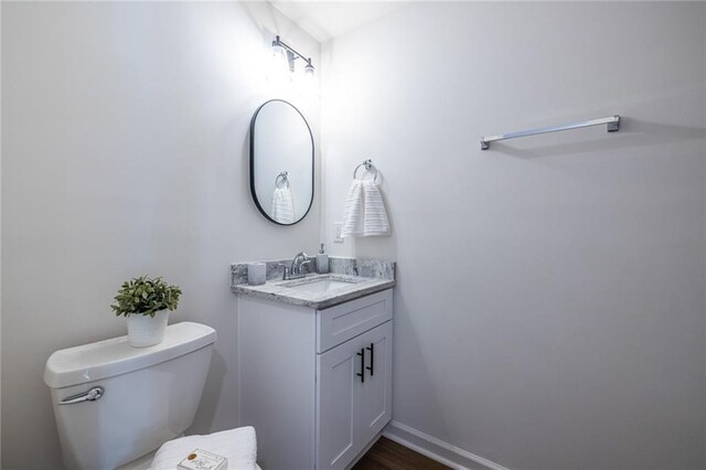96 Sam Alexander Rd, Douglasville, GA 30134 - bathroom with baseboards, toilet, and vanity