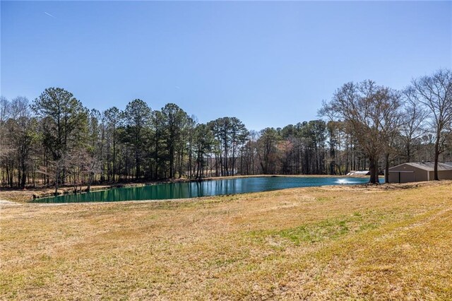 96 Sam Alexander Rd, Douglasville, GA 30134 - view of pool featuring a lawn, a water view, and a forest view