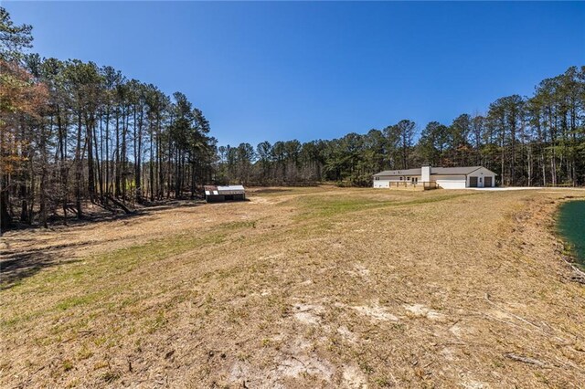 96 Sam Alexander Rd, Douglasville, GA 30134 - view of yard featuring a forest view and a garage